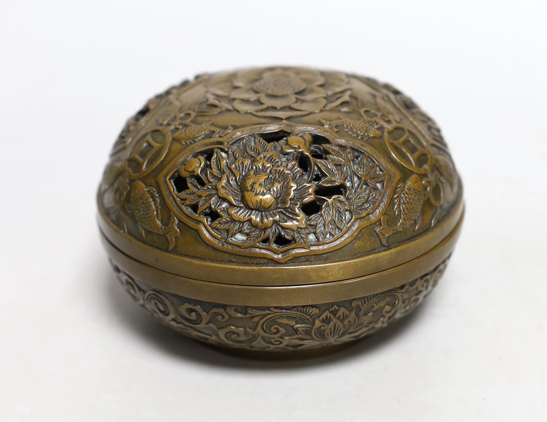 A Chinese circular carved bronze censer, 13.5cm diameter